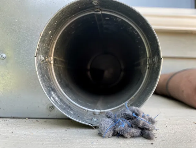 Kendall Dryer Vent Cleaning technician using specialized equipment to clear severe dryer vent blockage in Kendall